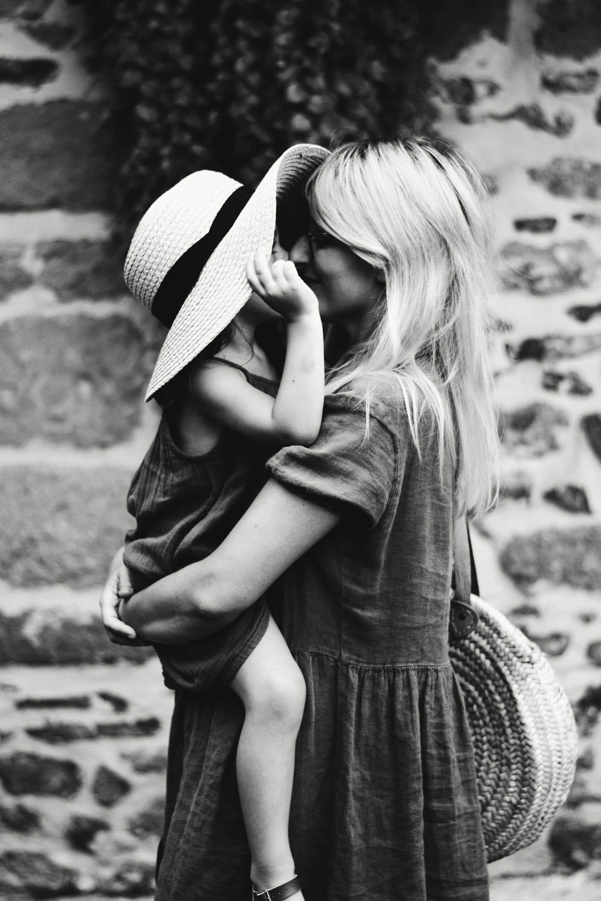 A mother holding her young child